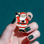 Santa’s Surprise Enamel Pin